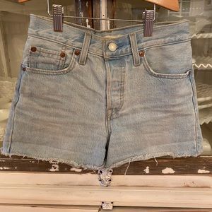 High rise light wash vintage denim Levi’s shorts.